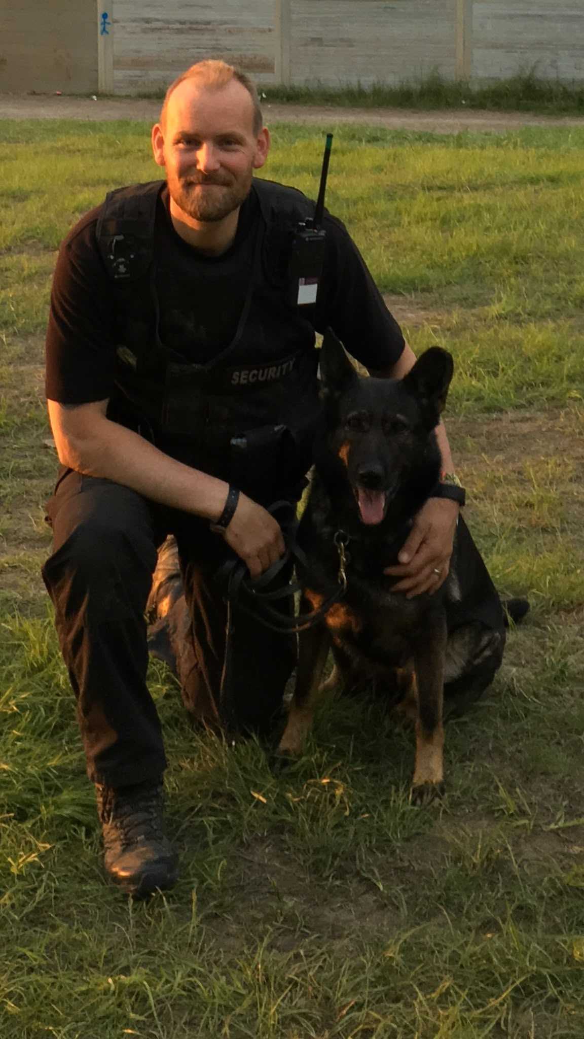 Security handler with a working dog