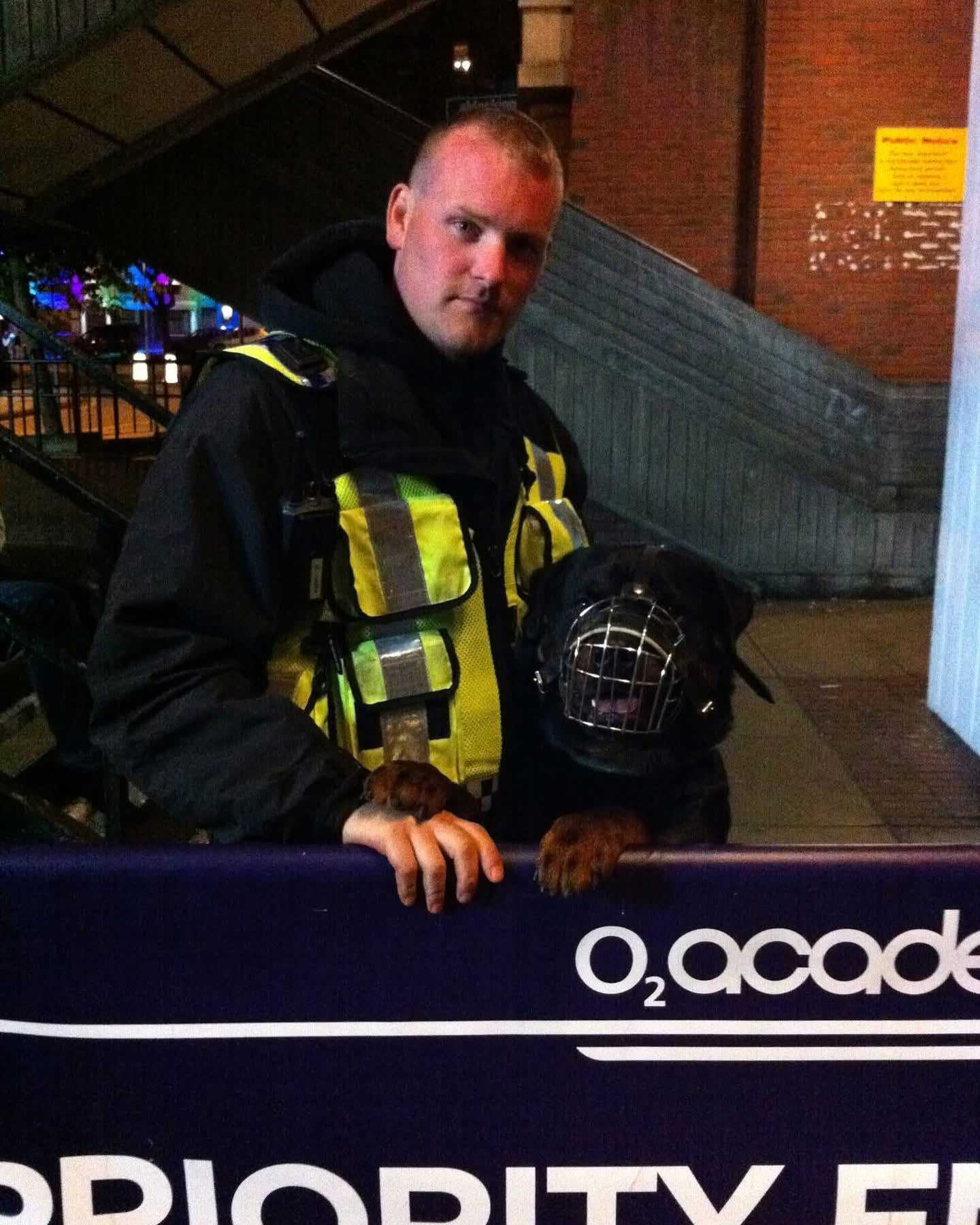 Event security handler with a working dog on duty